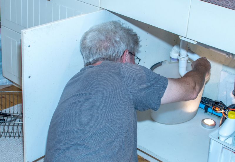 Plumber Fixing Pipe